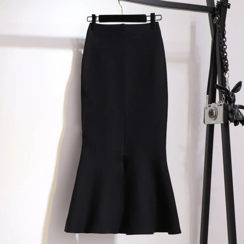 Classic black asymmetric mermaid skirt with front button placket and flared hem