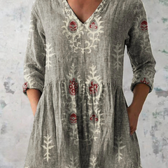 Gray long-sleeve V-neck embroidered blouse with gathered waist and folk panel motifs