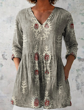 Gray long-sleeve V-neck embroidered blouse with gathered waist and folk panel motifs