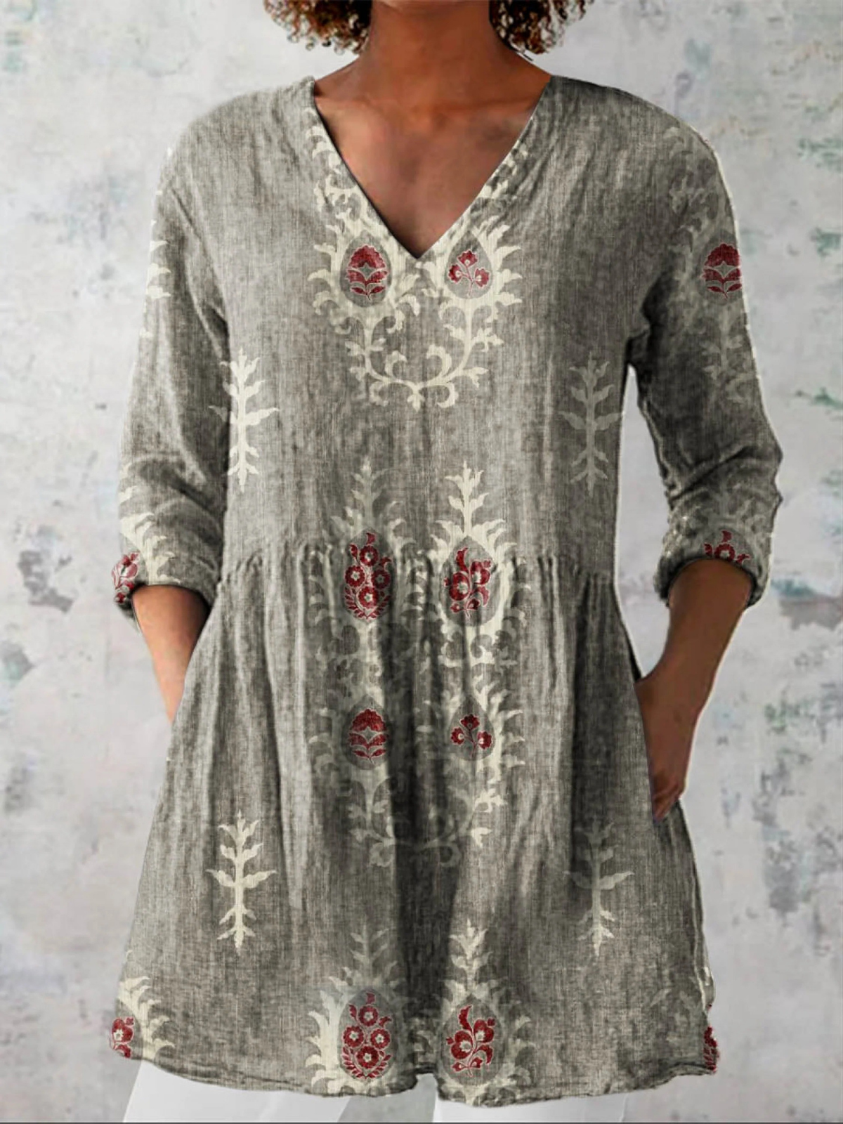 Gray long-sleeve V-neck embroidered blouse with gathered waist and folk panel motifs