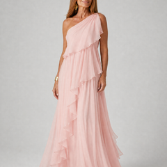 Pink one-shoulder maxi dress with layered ruffles and airy chiffon skirt