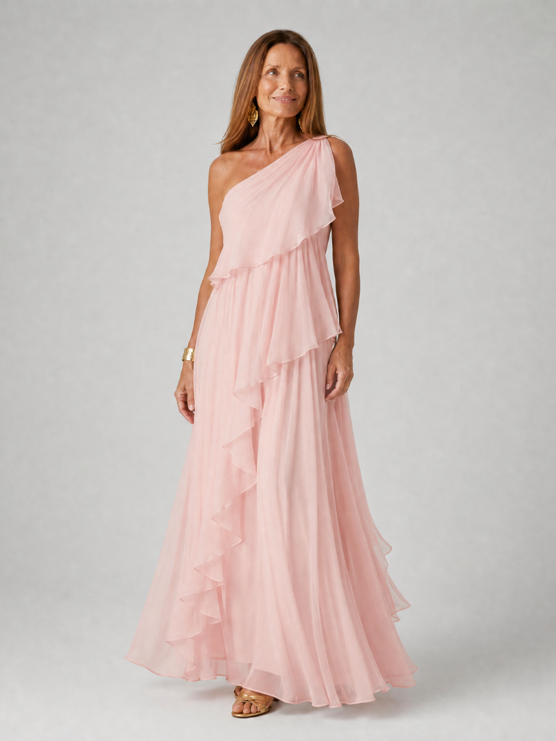 Pink one-shoulder maxi dress with layered ruffles and airy chiffon skirt
