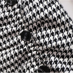 Houndstooth fabric asymmetric skirt with black button closures
