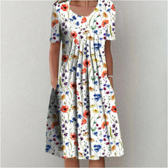 Gigi™ coverage dress, white base with red yellow and blue floral print, short sleeves