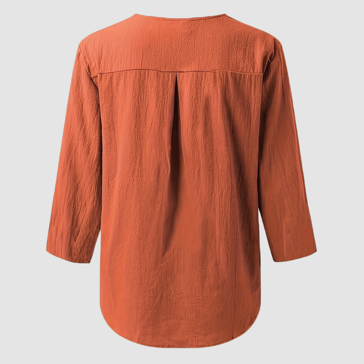 Rust orange cotton-linen blouse back with yoke pleats and 3/4-length sleeves