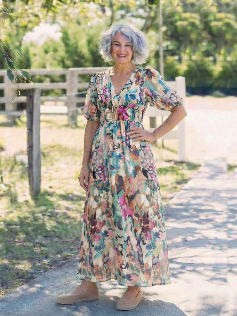 Floral V-neck midi dress with gathered waist and full flowing skirt
