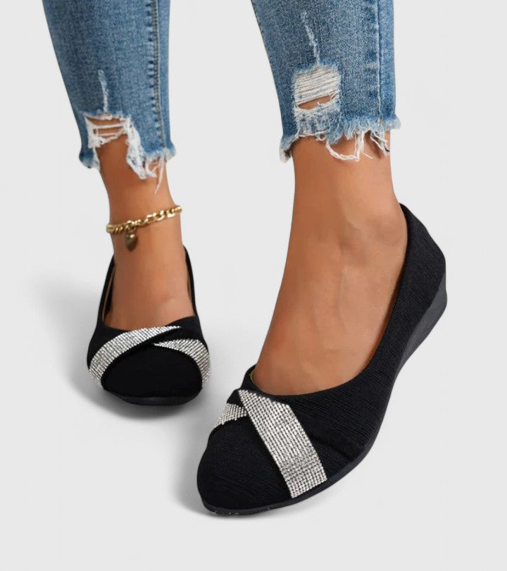 Black orthopedic slip-on flats with silver glitter strap and low cushioned heel