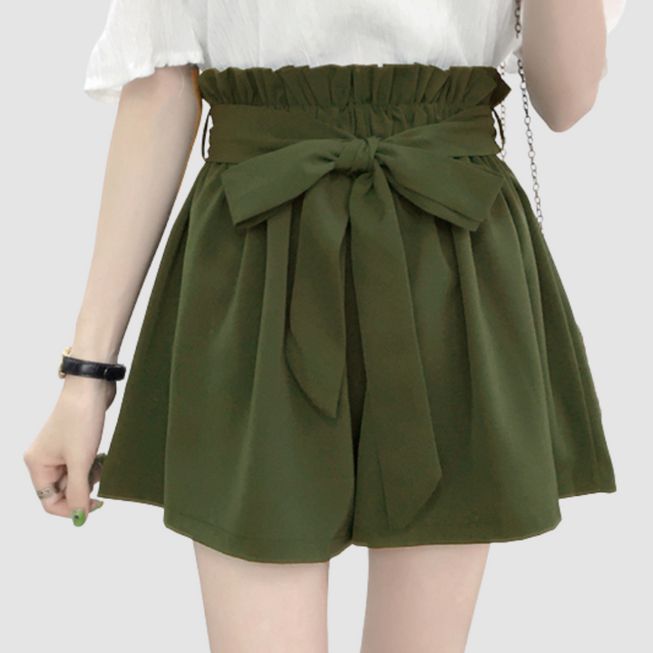 Army green paperbag waist shorts with tied bow and pleated elastic waistband.
