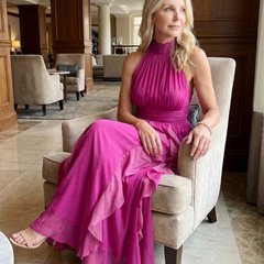 Pink high-neck sleeveless maxi dress with ruched bodice and layered ruffle skirt