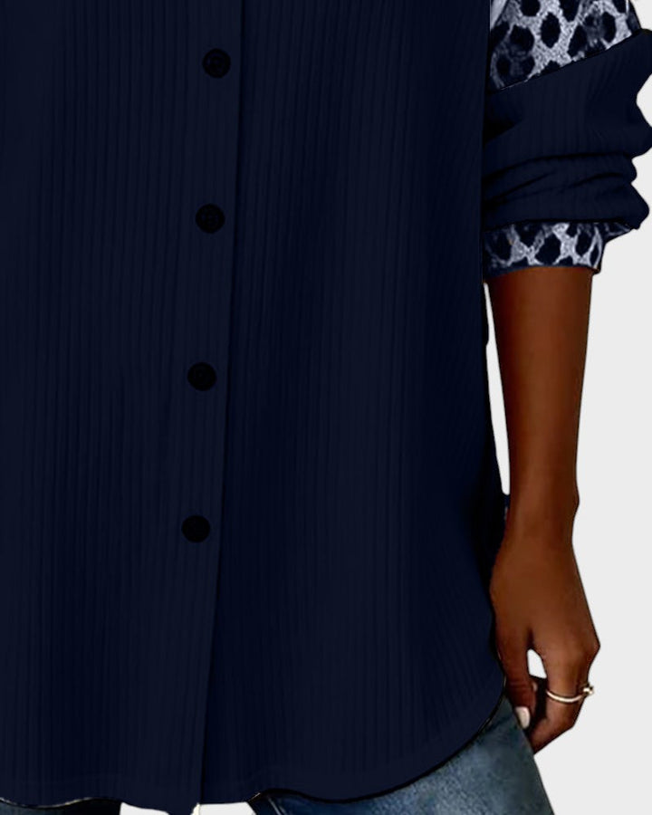 Dark blue button-down shirt with pintuck-style texture and button placket