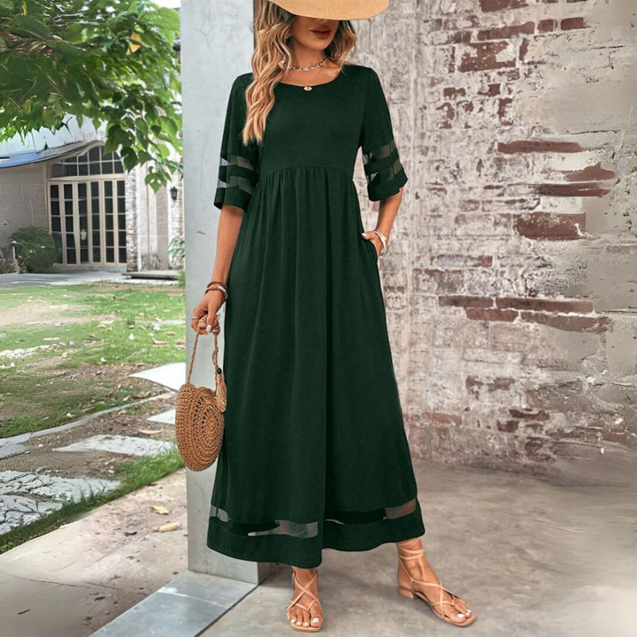 Green A-line midi dress with elbow sleeves and sheer stripe trim at cuffs and hem