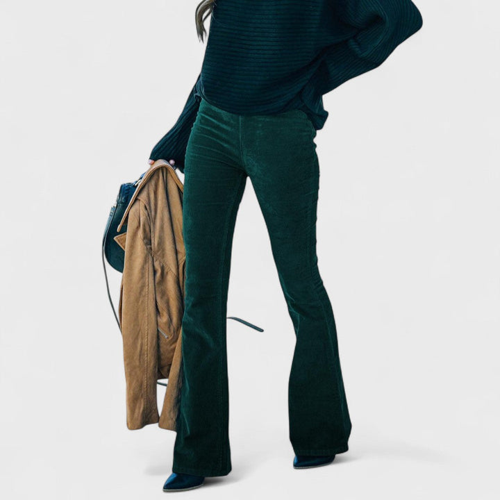 Flared corduroy trousers, dark green with subtle vertical cord texture
