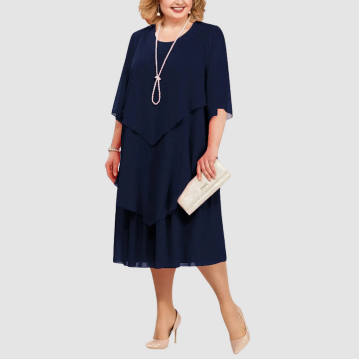 Navy chiffon midi dress with layered ruffle front, short sleeves, and round neckline