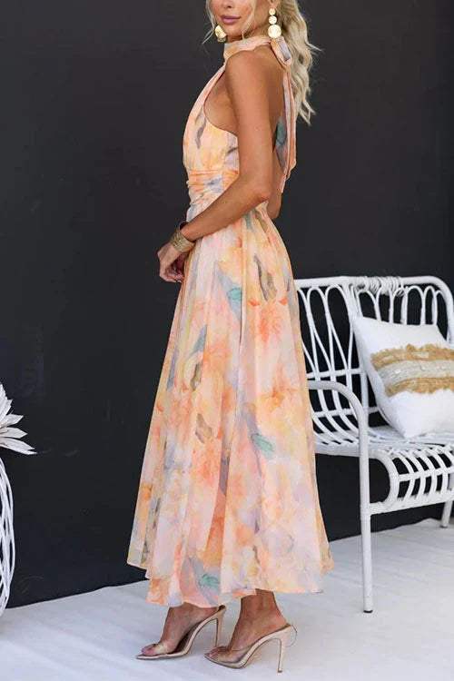 Elegant sleeveless halter midi dress, peach and pastel blue watercolor floral, side view