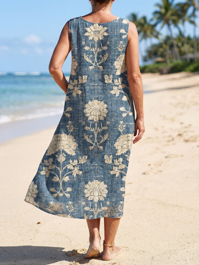 Blue sleeveless midi dress viewed from back, cream floral print