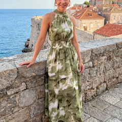 Green abstract print gathered-waist midi dress with sleeveless halter neckline, outdoor