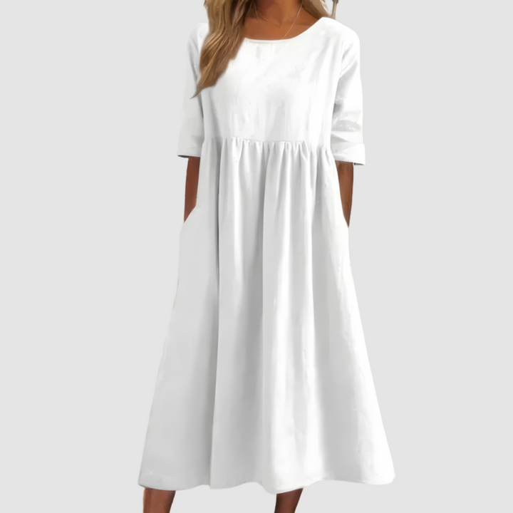 White breezy dress with gathered waist and three-quarter sleeves, full A-line skirt