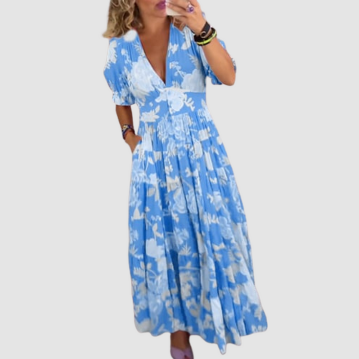 Blue floral maxi dress with V-neck and puff sleeves, gathered tiered hem