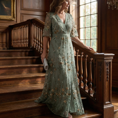Sage green floral halter maxi dress with V-neck and short flutter sleeves, flowing skirt