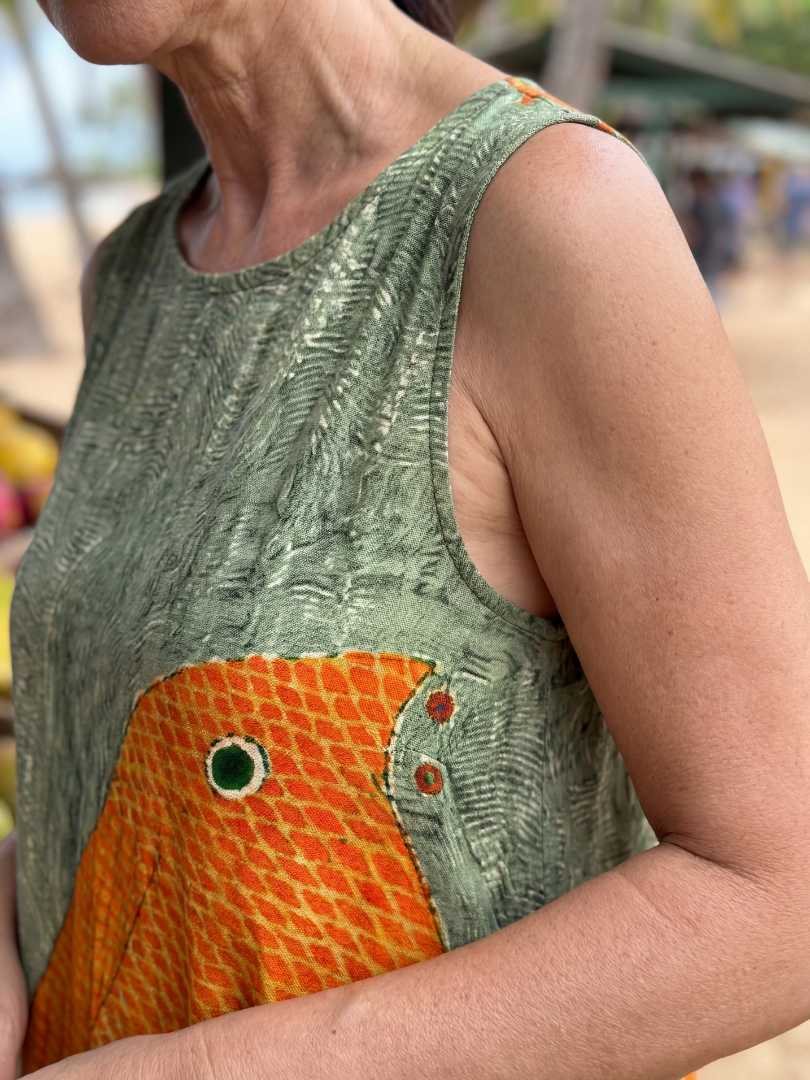 Olive green sleeveless midi dress with orange octopus wave pocket print detail
