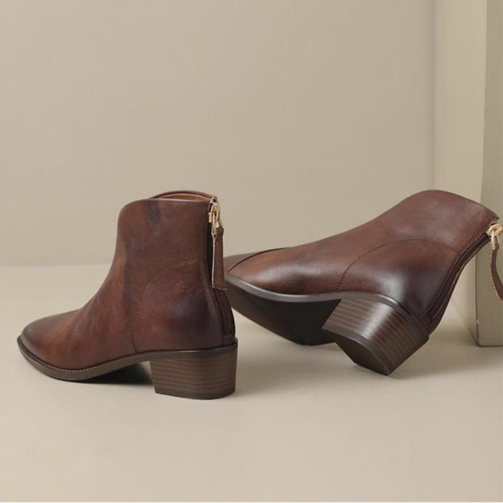 Brown leather ankle boots with side zipper opening and mid block heel