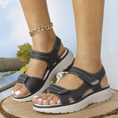 Dark grey orthopaedic support sandal with adjustable hook-and-loop straps and cushioned sole