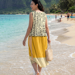 Sleeveless midi dress, cream with black dots and yellow skirt; back view