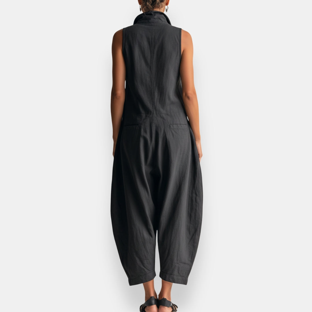 Black oversized sleeveless jumpsuit, back view with roomy straight-leg fit
