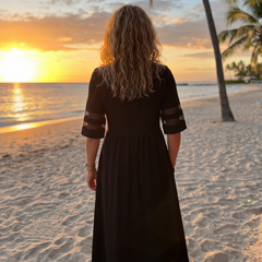 Black midi dress, back view with short sleeves and gathered waist