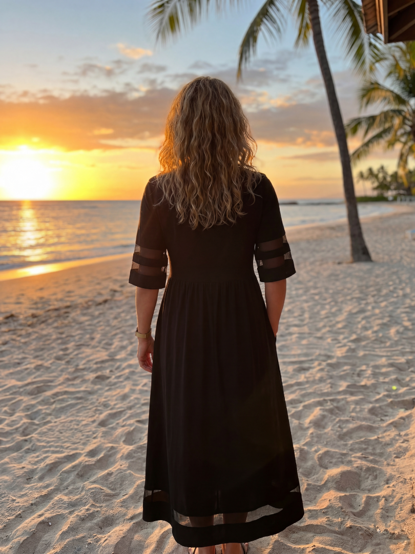 Black midi dress, back view with short sleeves and gathered waist