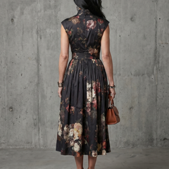 Black floral pleated midi dress back view with high neck and gathered waist