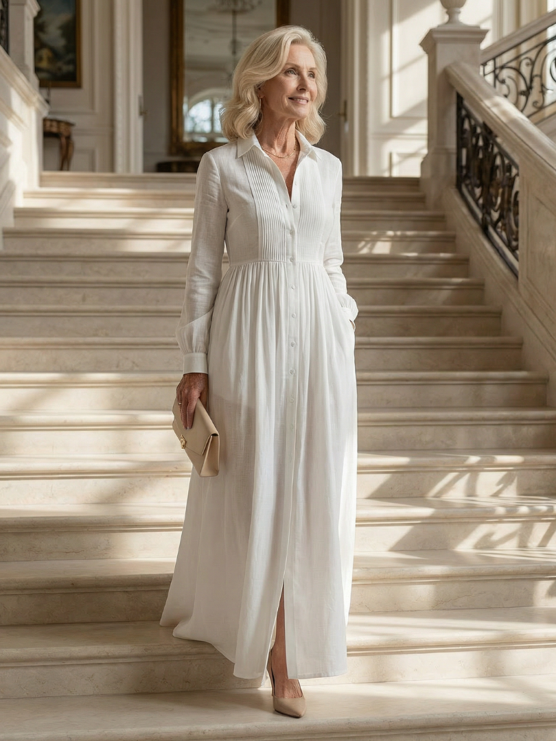 White soft flow maxi dress with V-neck, button front, long sleeves, pleated skirt