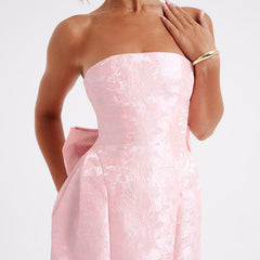 Pink strapless jacquard mini dress with sweetheart shape and waist bow-knot detail