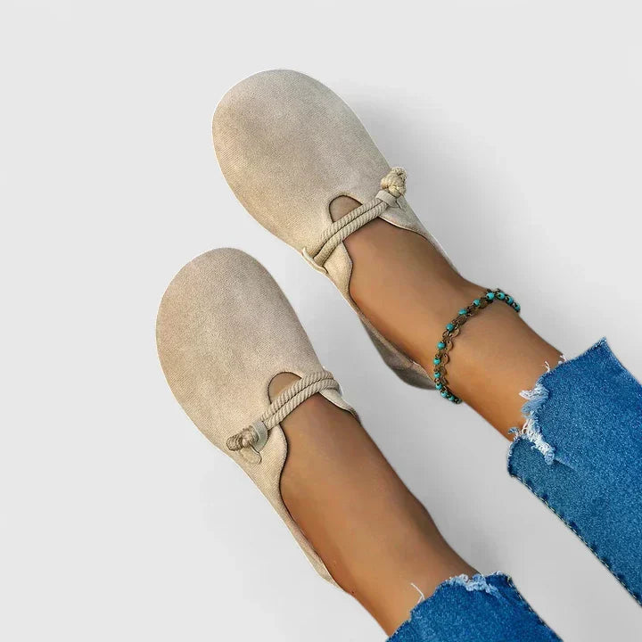 Beige orthopedic loafer slip-on pair with braided bow strap detail