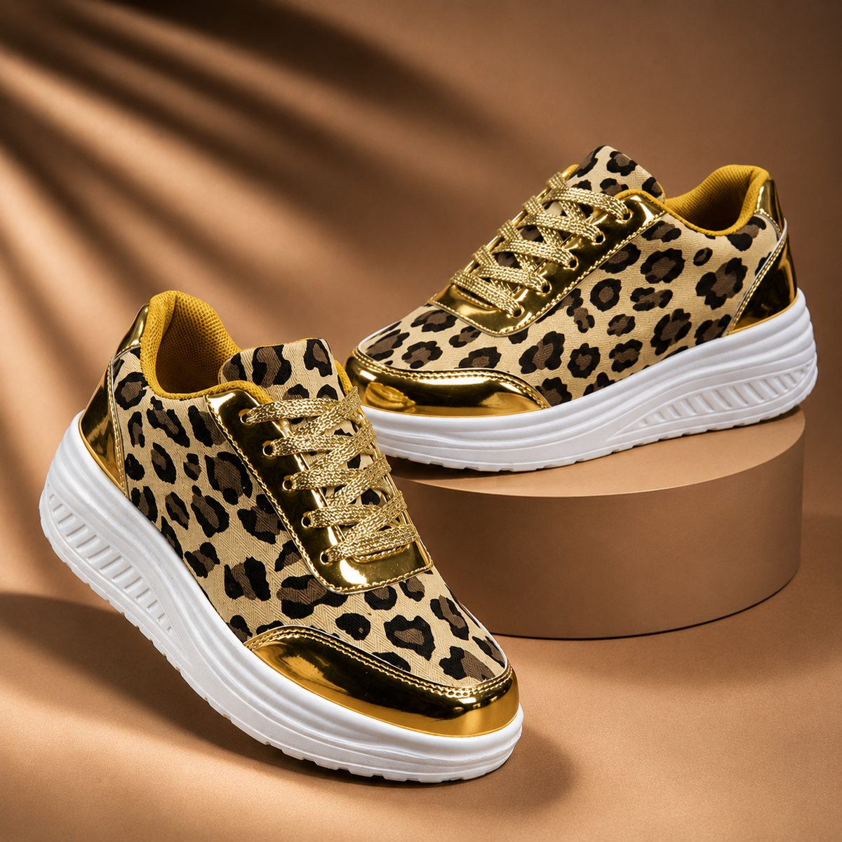 Leopard print platform sneakers with gold metallic accents, lace-up, white sole