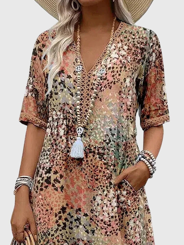 Multicolor floral V-neck midi dress with button placket and white tassel