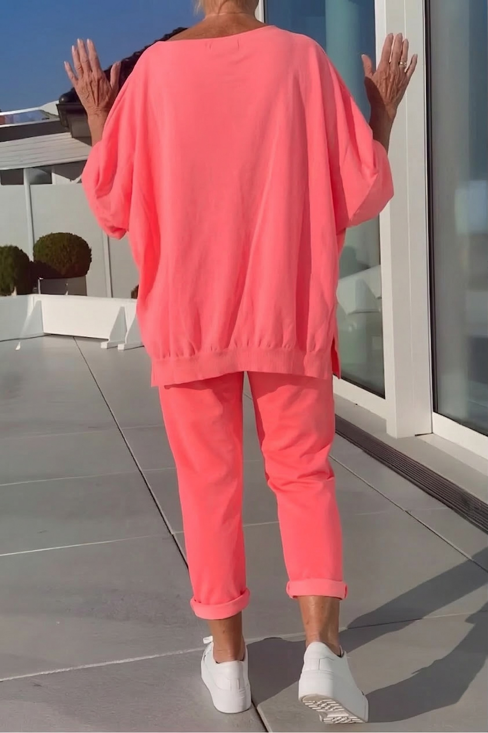 Neon yellow relaxed lounge set with oversized top and cuffed jogger pants
