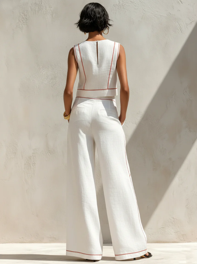 White sleeveless two-piece set, back view, red piping, wide-leg trousers