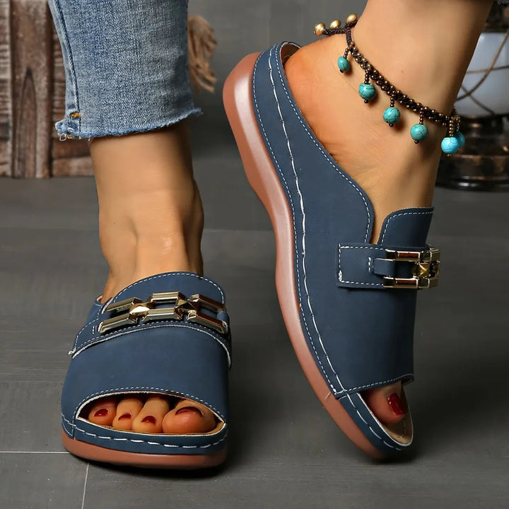 Blue comfort sandals with gold buckle, open toe, sturdy cushioned sole