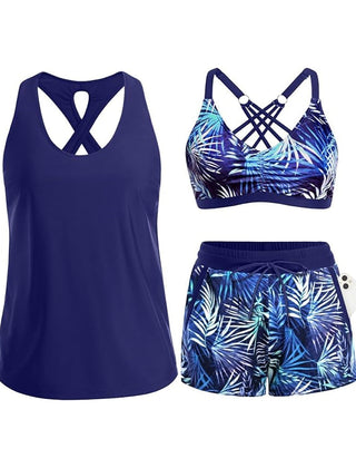 Navy tropical swim set with crisscross cutout tank, blue leaf-print bra, drawstring shorts