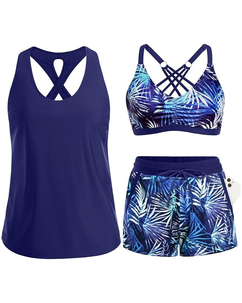 Navy tropical swim set with crisscross cutout tank, blue leaf-print bra, drawstring shorts