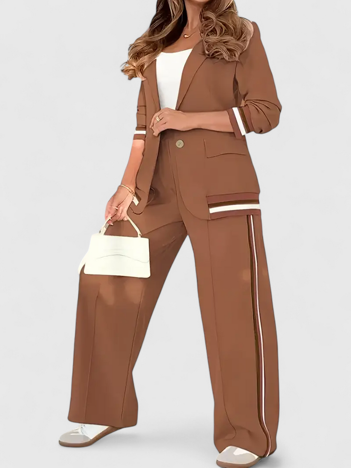 Brown lounge set with cropped jacket and wide-leg pants featuring contrast striped trim