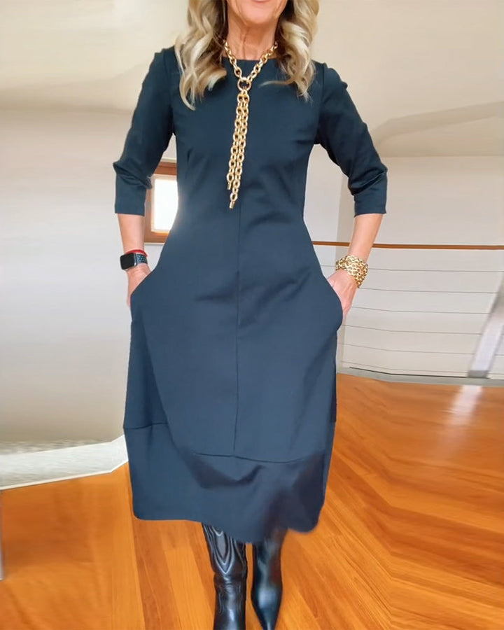Nia casual elegance dress, dark color, 3/4 sleeves, midi length, fitted through bodice