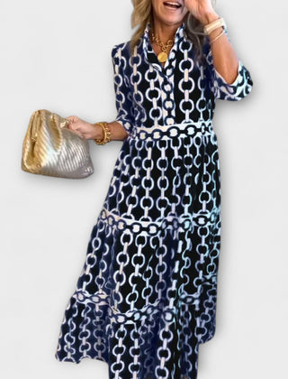Black chain-print midi dress with short sleeves and tiered skirt