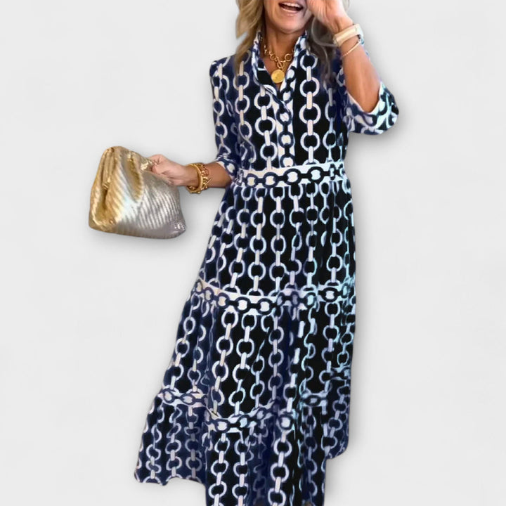 Black chain-print midi dress with short sleeves and tiered skirt