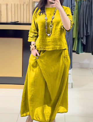 Yellow two-piece outfit: long-sleeve tunic and gathered midi skirt with pockets