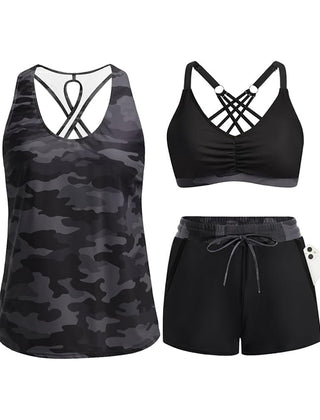 Black camouflage tropical swim set with crisscross cutout tank, solid black bra, drawstring shorts