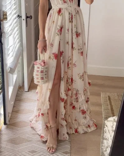Cream floral maxi dress with V-neck straps, cinched waist, and ruffled tiered hem