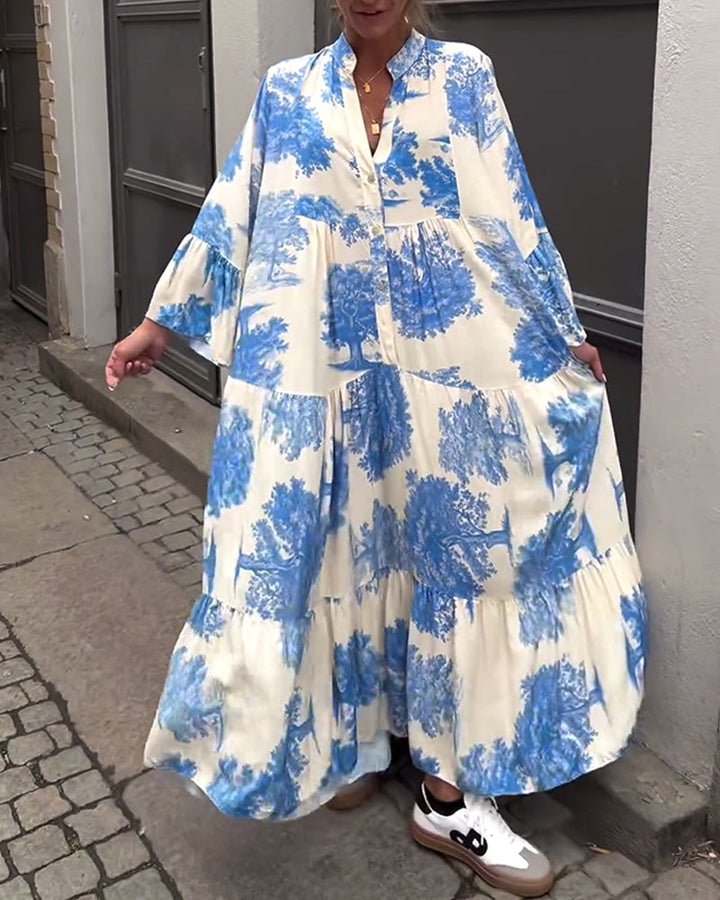 Flowing long blue-and-white printed maxi dress with V-neck and button front