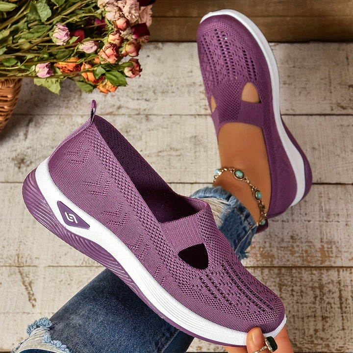 Lilac orthopedic slip-on shoes with perforated knit upper, white sole, side cutouts